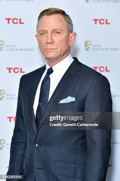 Daniel Craig poses during the "BAFTA: A Life in Pictures with Daniel Craig" supported by TCL mobile photocall at Odeon Luxe Leicester Square on...