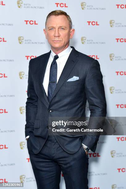 Daniel Craig poses during the "BAFTA: A Life in Pictures with Daniel Craig" supported by TCL mobile photocall at Odeon Luxe Leicester Square on...