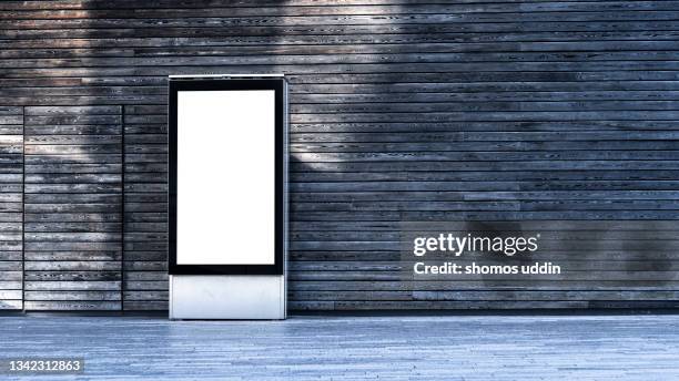 blank digital advertising display against wall - light box stock-fotos und bilder