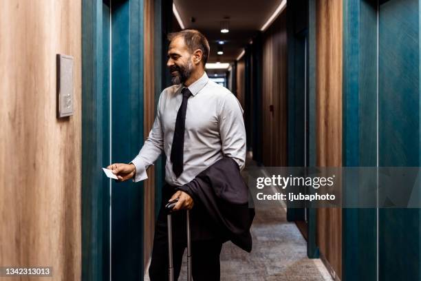 businessman opening hotel room - keycard access bildbanksfoton och bilder