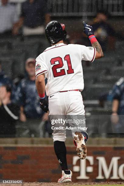 Eddie Rosario of the Atlanta Braves celebrates after hitting a home run against the Colorado Rockies during the fifth inning at Truist Park on...