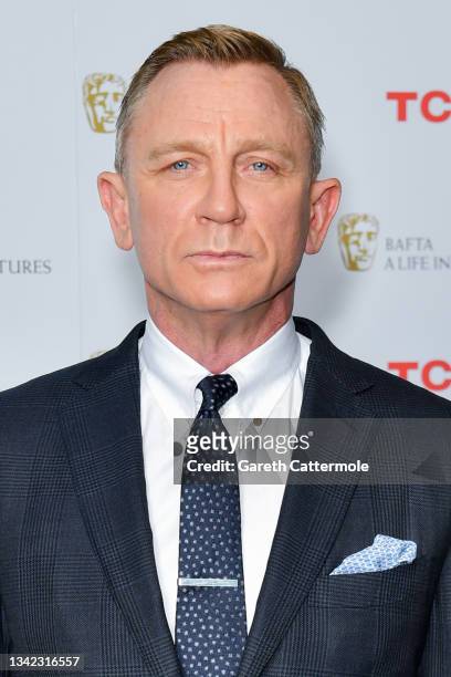 Daniel Craig poses during the "BAFTA: A Life in Pictures with Daniel Craig" supported by TCL mobile photocall at Odeon Luxe Leicester Square on...
