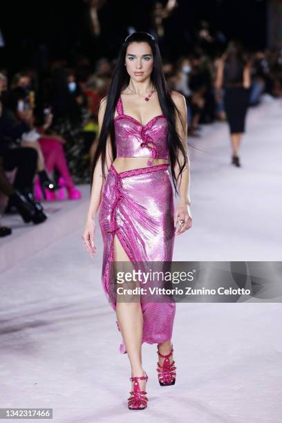 Dua Lipa walks the runway at the Versace fashion show during the Milan Fashion Week - Spring / Summer 2022 on September 24, 2021 in Milan, Italy.