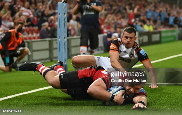 Ruan Ackermann of Gloucester dives over to score his side's second try during the Gallagher Premiership Rugby match between Gloucester Rugby and...