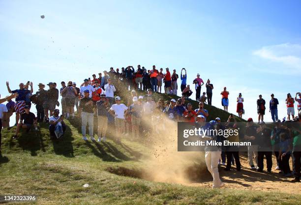 Rory McIlroy of Northern Ireland and team Europe plays his shot from the bunker during Friday Afternoon Fourball Matches of the 43rd Ryder Cup at...