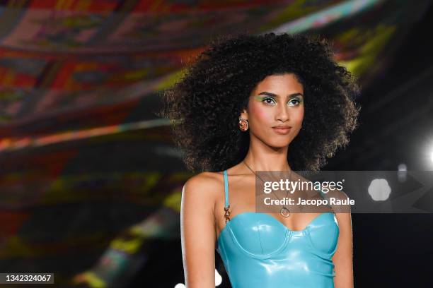 Imaan Hammam walks the runway at the Versace fashion show during the Milan Fashion Week - Spring / Summer 2022 on September 24, 2021 in Milan, Italy.