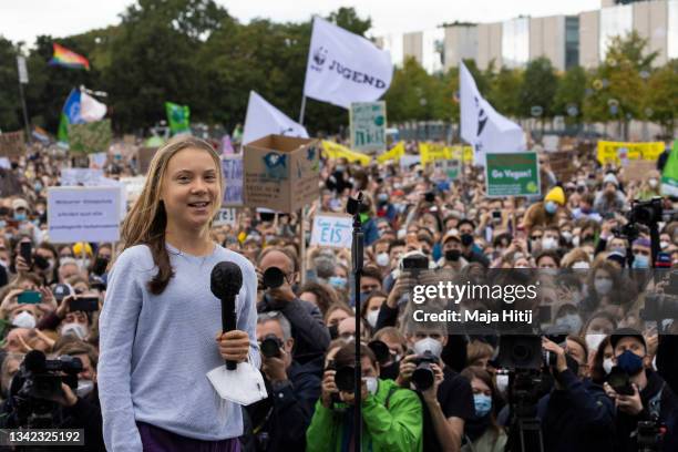 Climate activist Greta Thunberg speaks at a large-scale climate strike march by Fridays for Future in front of the Reichstag on September 24, 2021 in...