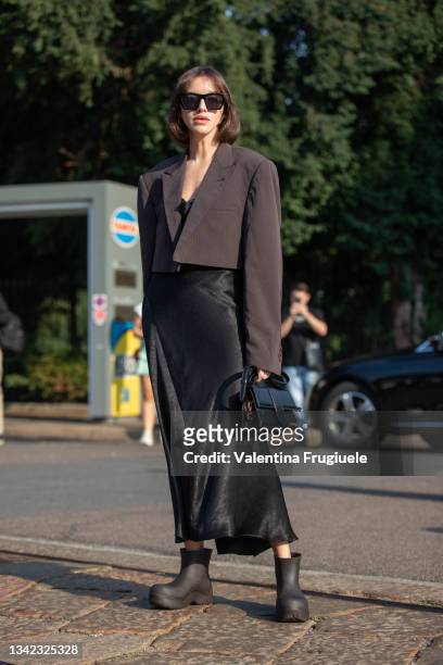Nastya Burlaka outside Tod's fashion show wearing Jacquemus bag, Varied.clo jacket, Bottega Veneta shoes, Capsula sunglasses and Musecloths dress...