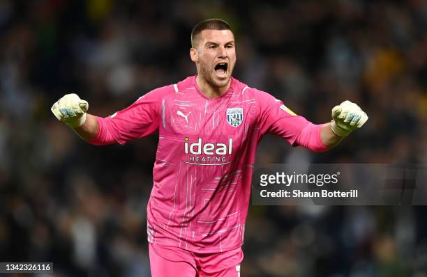 Sam Johnstone of West Bromwich Albion celebrates their first goal, an own goal scored by Seny Dieng of Queens Park Rangers during the Sky Bet...