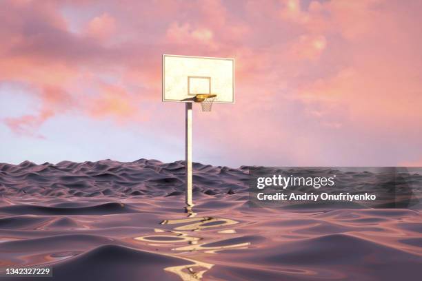 basketball hoop going under water - basket stock-fotos und bilder