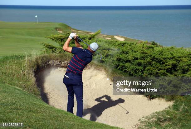 Justin Thomas of team United States plays his shot from the bunker on the eighth hole during Friday Afternoon Fourball Matches of the 43rd Ryder Cup...