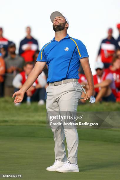 Jon Rahm of Spain and team Europe reacts after missing a putt on the 14th green during Friday Afternoon Fourball Matches of the 43rd Ryder Cup at...