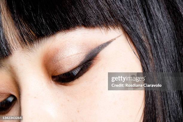 Model poses, eye detail, in the backstage of the John Richmond fashion show during the Milan Fashion Week - Spring / Summer 2022 on September 24,...
