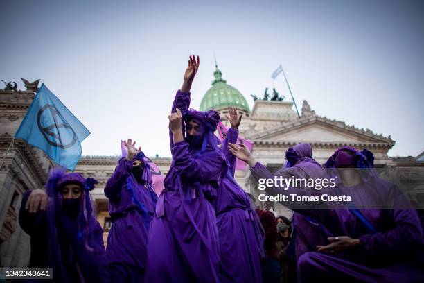 Demonstrators using burkas perform as part of Friday's For Future Strike at National Congress on September 24, 2021 in Buenos Aires, Argentina. The...