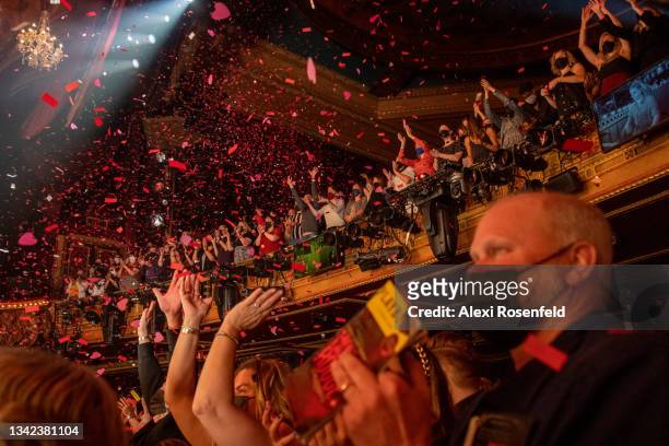 Audience members applaud and cheer during "Moulin Rouge!" at Al Hirschfeld Theatre on September 24, 2021 in New York City. This is the first show of...