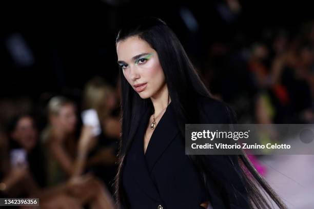 Dua Lipa walks the runway at the Versace fashion show during the Milan Fashion Week - Spring / Summer 2022 on September 24, 2021 in Milan, Italy.