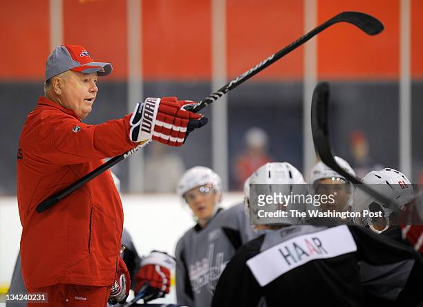 Capitals coach Bruce Boudreau, left, instructs players during the Washington Capitals 2011 development camp at Kettler Capitals Iceplex in Ballston...