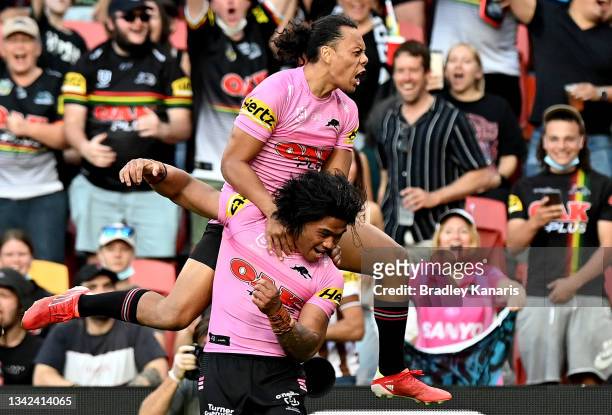 Brian To'o and Jarome Luai of the Panthers celebrate a try during the NRL Grand Final Qualifier match between the Melbourne Storm and the Penrith...