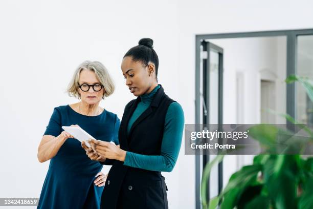 business people discussing ideas in the office - senior businesswoman stock pictures, royalty-free photos & images