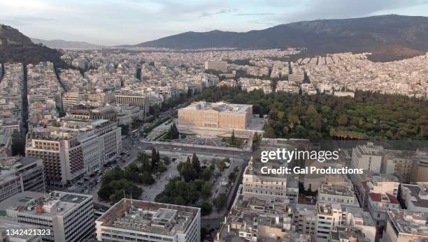 hellenic parliament with  athens in background / aerial - greek parliament stock pictures, royalty-free photos & images