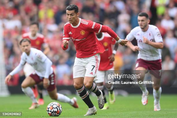 Cristiano Ronaldo of Manchester United runs with the ball during the Premier League match between Manchester United and Aston Villa at Old Trafford...