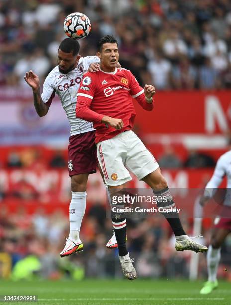 Cristiano Ronaldo of Manchester United battles for the header with Douglas Luiz of Aston Villa during the Premier League match between Manchester...