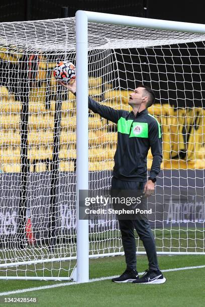 Referee Jarred Gillett performs pre match goal line tests ahead of the Premier League match between Watford and Newcastle United at Vicarage Road on...