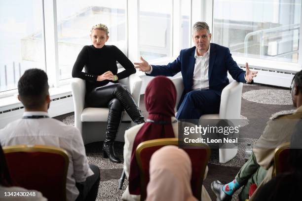 Labour Leader Keir Starmer speaks to former 'Love Island' star Amy Hart during a youth fringe meeting on September 25, 2021 in Brighton, United...