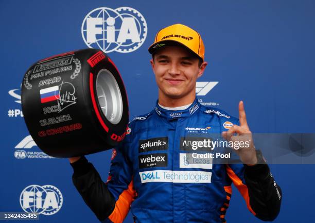 Pole position qualifier Lando Norris of Great Britain and McLaren F1 celebrates in parc ferme during qualifying ahead of the F1 Grand Prix of Russia...