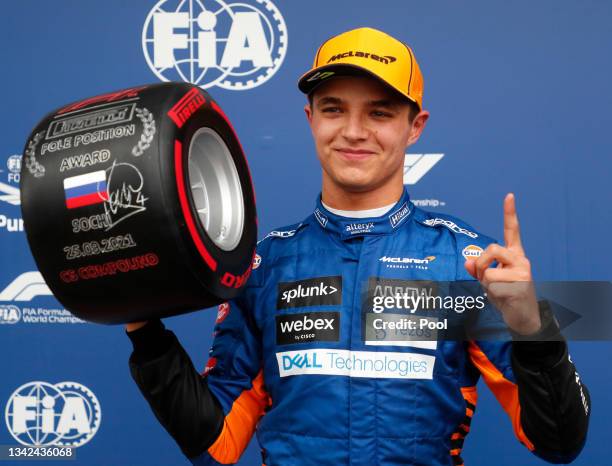 Pole position qualifier Lando Norris of Great Britain and McLaren F1 celebrates in parc ferme during qualifying ahead of the F1 Grand Prix of Russia...