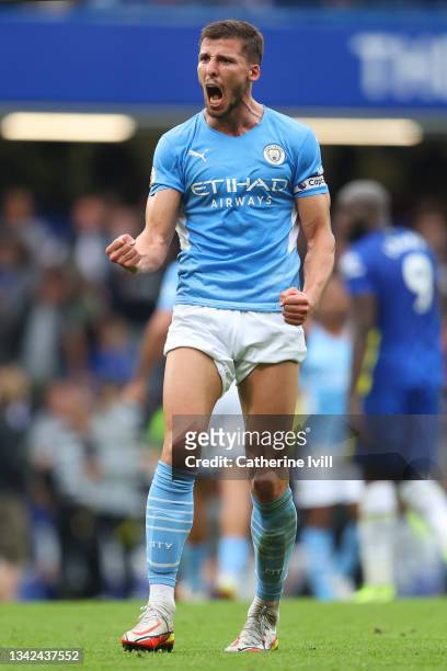 Ruben Dias of Manchester City celebrates following his team's victory in the Premier League match between Chelsea and Manchester City at Stamford...