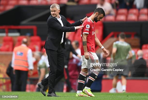 Ole Gunnar Solskjaer, Manager of Manchester United with Bruno Fernandes after the Premier League match between Manchester United and Aston Villa at...