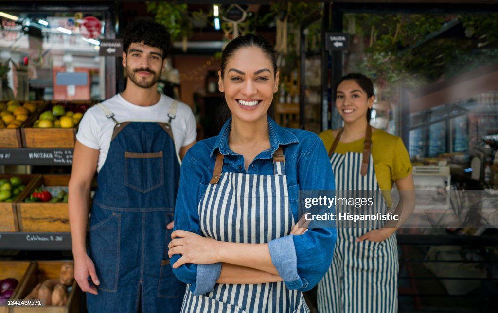 Woman leading a group of salespersons working at a food market