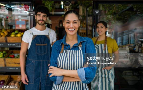 woman leading a group of salespersons working at a food market - entrepreneur stock pictures, royalty-free photos & images
