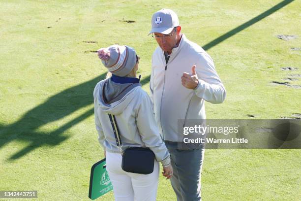 Captain Padraig Harrington of Ireland and team Europe and wife Caroline Harrington meet on the seventh tee during Saturday Morning Foursome Matches...