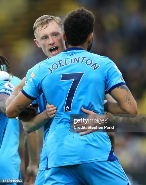 Sean Longstaff of Newcastle United celebrates scoring his sides first goal with Joelinton of Newcastle United during the Premier League match between...