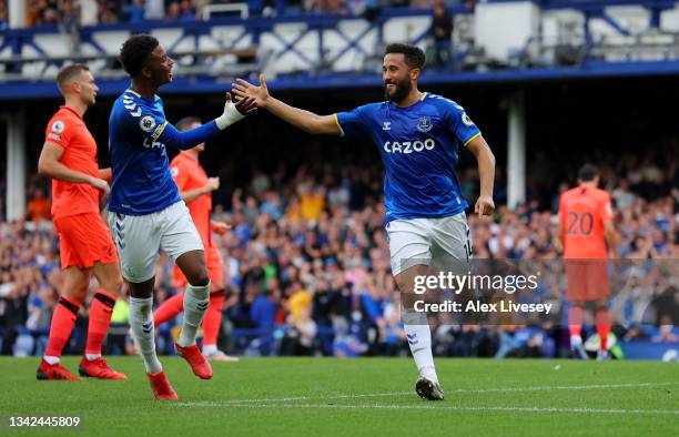 Andros Townsend of Everton celebrates with Demarai Gray after scoring their side's first goal during the Premier League match between Everton and...