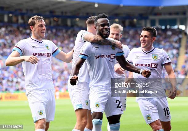 Maxwel Cornet of Burnley celebrates with team mates after scoring their side's second goal during the Premier League match between Leicester City and...