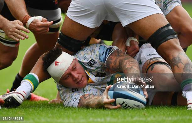 Teimana Harrison of Northampton Saints places the ball at a ruck during the Gallagher Premiership Rugby match between Exeter Chiefs and Northampton...