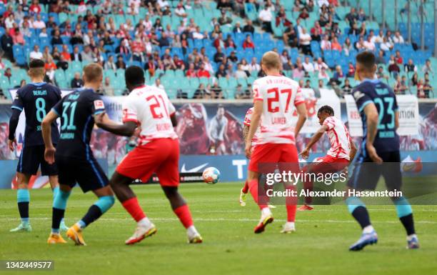 Christopher Nkunku of RB Leipzig scores his sides fifth goal during the Bundesliga match between RB Leipzig and Hertha BSC at Red Bull Arena on...