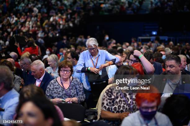 Delegates cast their votes during a ballot on the election of General secretary of the Labour party David Evans, on day one of the Labour Party...