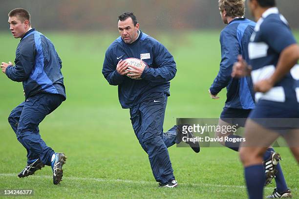 Joe Roff, the former Wallaby, runs with the ball during the Help for Heroes Rugby Challenge Southern Hemisphere training session held at Tedworth...