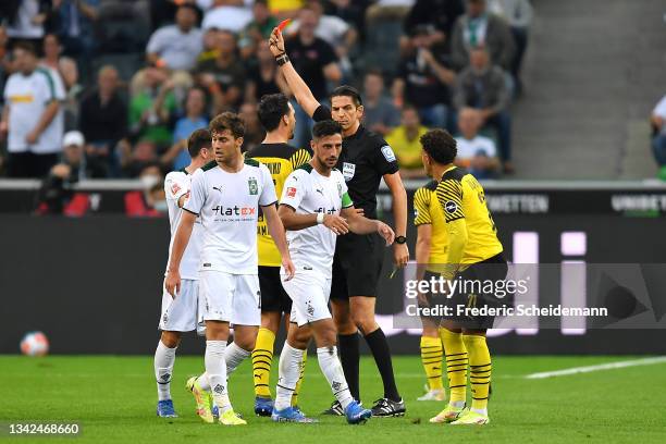 Mahmoud Dahoud of Borussia Dortmund receives a red card from match referee during the Bundesliga match between Borussia Mönchengladbach and Borussia...