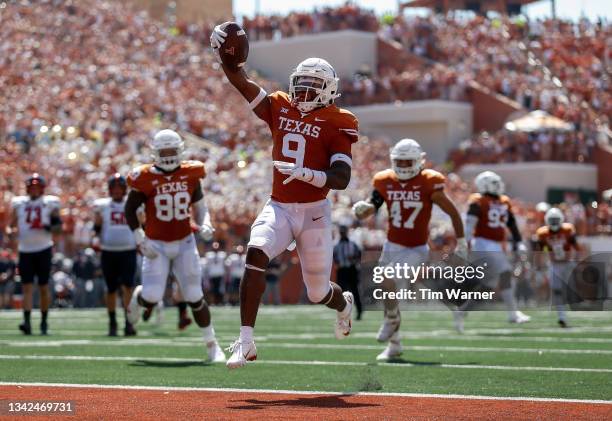 Josh Thompson of the Texas Longhorns intercepts a pass and returns it for a touchdown in the second quarter against the Texas Tech Red Raiders at...