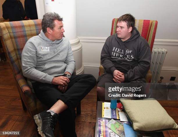 John Kirwan assistant coach of the Southern Hemisphere team talks to guardsman Paul Bennett, who was injured in Afghanistan, during the Help for...