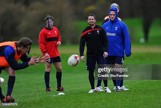 Wales winger Shane Williams shares a joke with his team mates who all wore Shane Williams masks at Wales training to mark 'Shane Williams day' ahead...