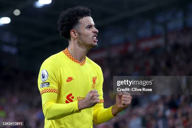 Curtis Jones of Liverpool celebrates after scoring their team's third goal during the Premier League match between Brentford and Liverpool at...