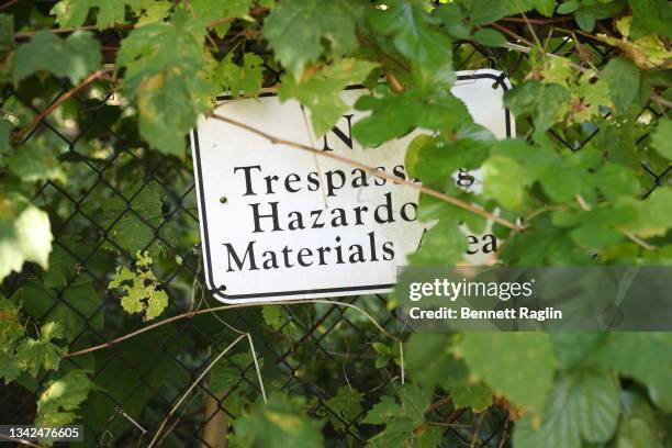 Sign marking 234 acres of contaminated parkland is seen during the " Liberty State Park For All Rally" at Liberty State Park on September 25, 2021 in...