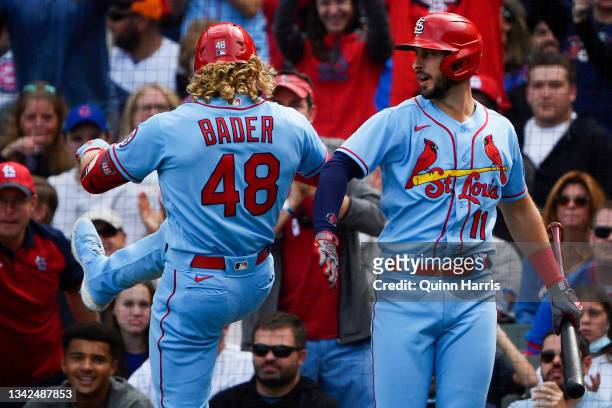 Harrison Bader and Paul DeJong of the St. Louis Cardinals celebrate after a solo home run in the second inning against the Chicago Cubs at Wrigley...