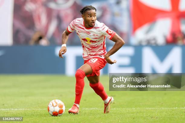 Christopher Nkunku of Leipzig runs with the ball during the Bundesliga match between RB Leipzig and Hertha BSC at Red Bull Arena on September 25,...